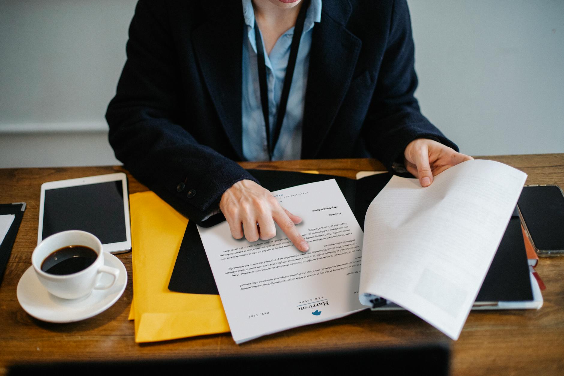 crop businesswoman working with documents in office